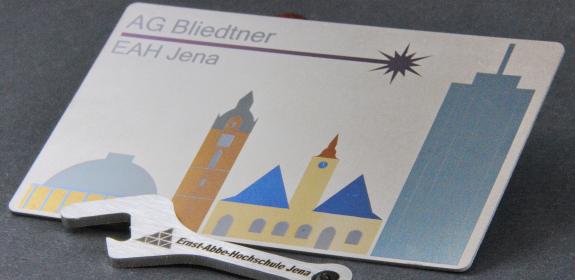 Mousepad der AG Bliedtner an der EAH Jena sowie Schraubenschlüssel der EAH Jena